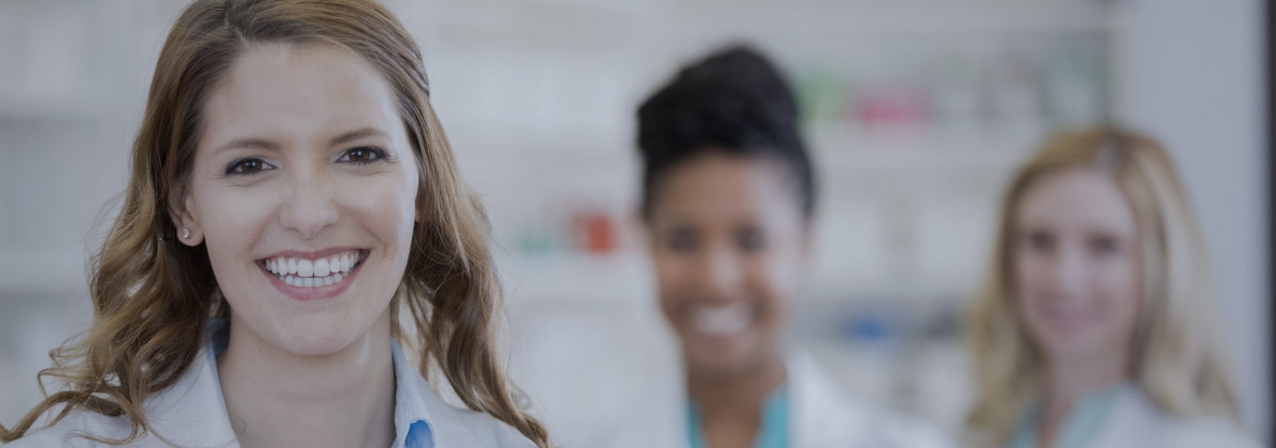 smiling 3 female pharmacists