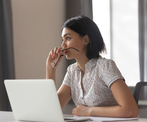 anxious asian business woman at computer